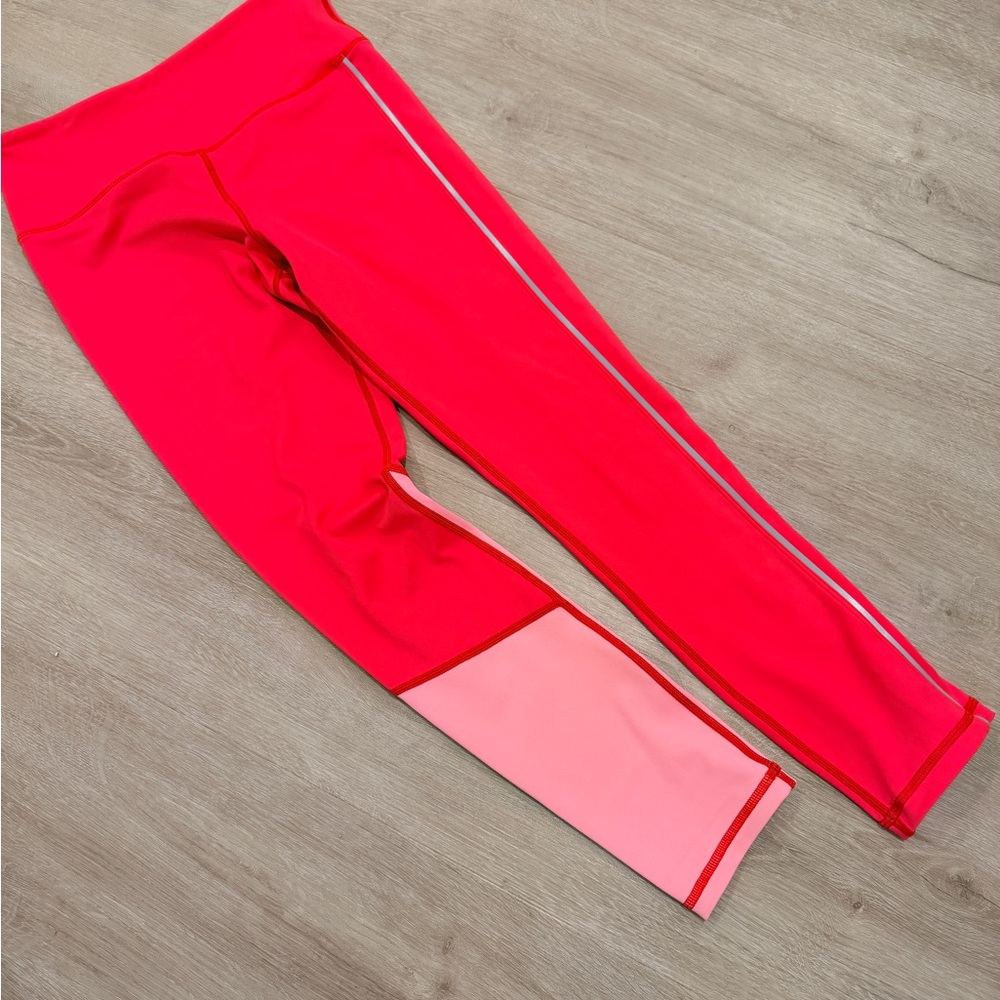 Hot pink light n tight leggings with color blocking and reflective stripe